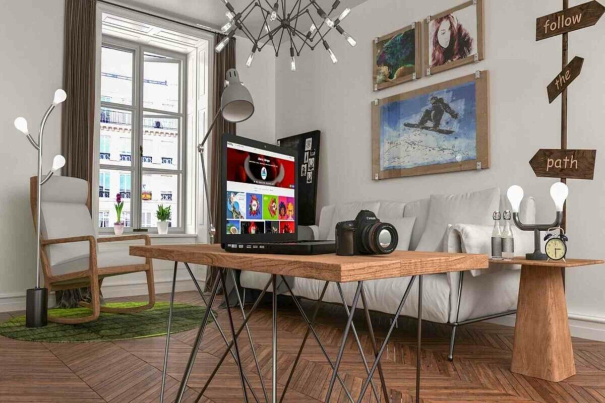 Una habitación con una computadora portátil y una cámara de alta calidad colocada sobre la mesa de madera.